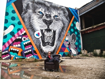 Dr. Shelli Rottschafer before the Greg Mike Mural painted 2016 Eastern Market – Murals in the Market Detroit, Michigan June 2018